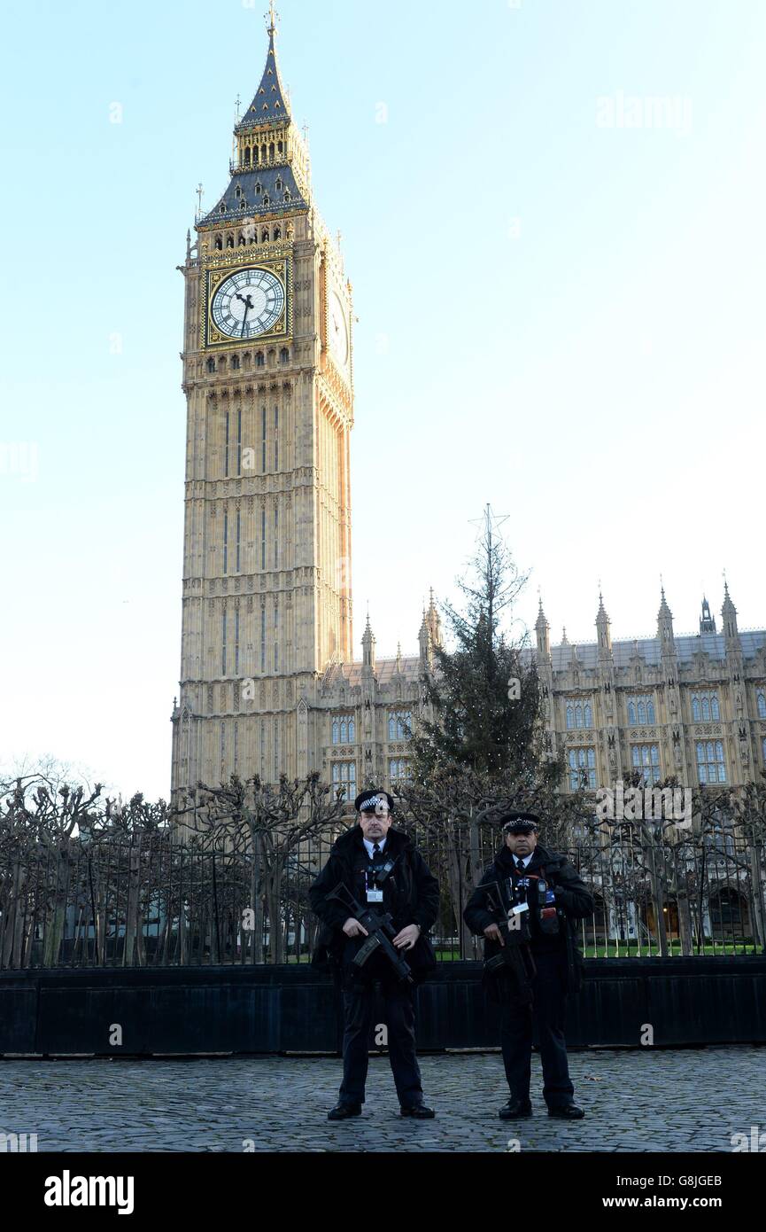 Armed police officers in Westminster, London, as thousands of police including increased numbers of firearms officers will be on duty as the capital ushers in the New Year tonight. Stock Photo
