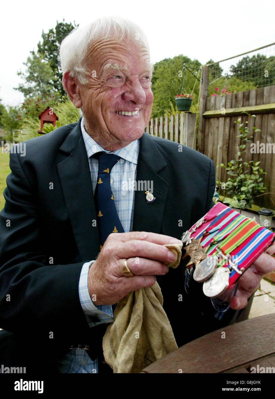George Housego age 84 at his home in West Wickham, Kent. George Housego, was captured in Java while a gunner with the Royal Artillery. He was placed on a notorious Japanese Hellship transporter and while on passage to Singapore, the ship was sunk by a US warplane. 'I managed to survive and after 12 hours of freedom I was picked up by a Jap fishing boat and turned in. I was then taken to Nagasaki and then on to another camp somewhere. Stock Photo