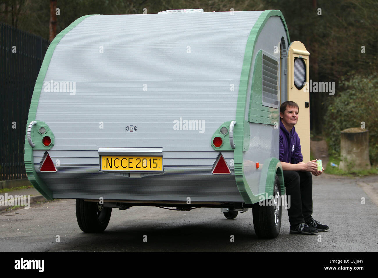 Ed Diment, Director at Bright Bricks with a full size caravan which has been made out of LEGO bricks by the company in Bordon, Hampshire. Stock Photo