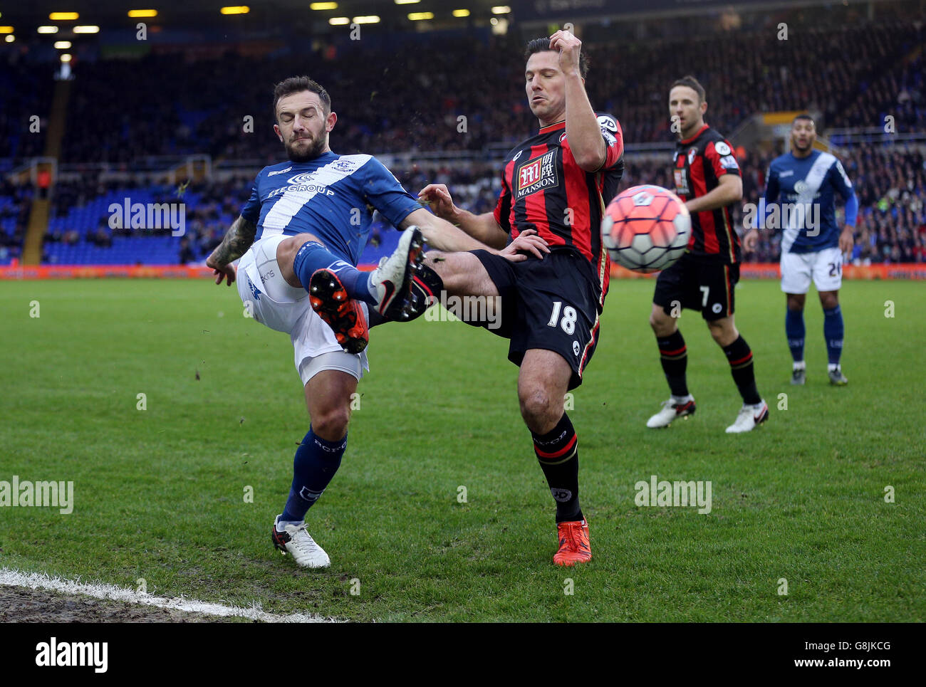Birmingham City's Neal Eardley (left) challenges AFC Bournemouth's Yann Kermorgant for the ball during the Emirates FA Cup, third round game at St Andrews, Birmingham. Stock Photo