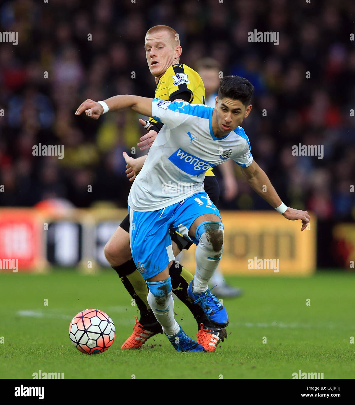 Watford's Ben Watson and Newcastle United's Ayoze Perez battle for the ball during the Emirates FA Cup, third round game at Vicarage Road, Watford. Stock Photo