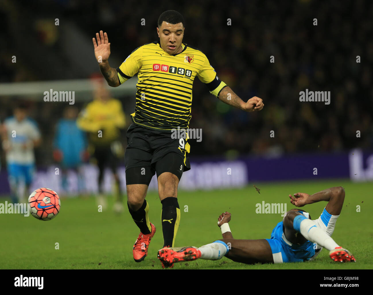 Watford's Troy Deeney is tackled by Newcastle United's Cheick Tiote during the Emirates FA Cup, third round game at Vicarage Road, Watford. Stock Photo