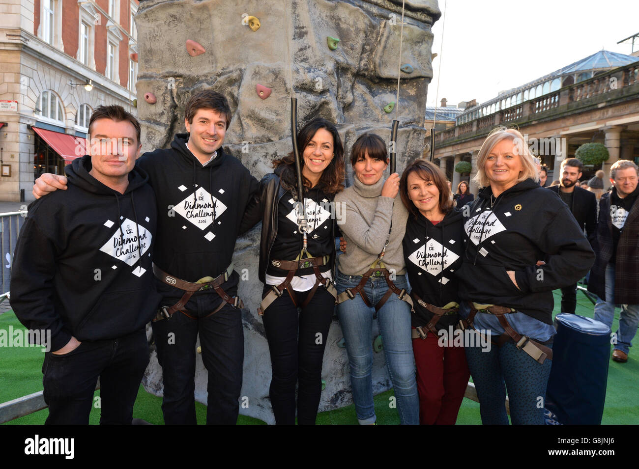 (left-right) Greg Burns, Zac Purchase, Julia Bradbury, Davina McCall, Arlene Phillips and Alice Beer pictured with a climbing wall in Covent Garden, London, to kick off the Duke of Edinburgh's Award Diamond Challenge. PRESS ASSOCIATION Photo. Picture date: Tuesday, 12 January 2016. Photo credit should read: Matt Crossick/PA Wire. Over the course of the day visitors will climb the height of Ben Nevis on the climbing wall - to mark the 60th anniversary of the charity. Stock Photo