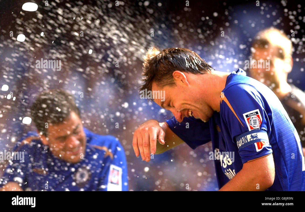 Chelsea captain John Terry celebrates, as champagne is sprayed. Stock Photo