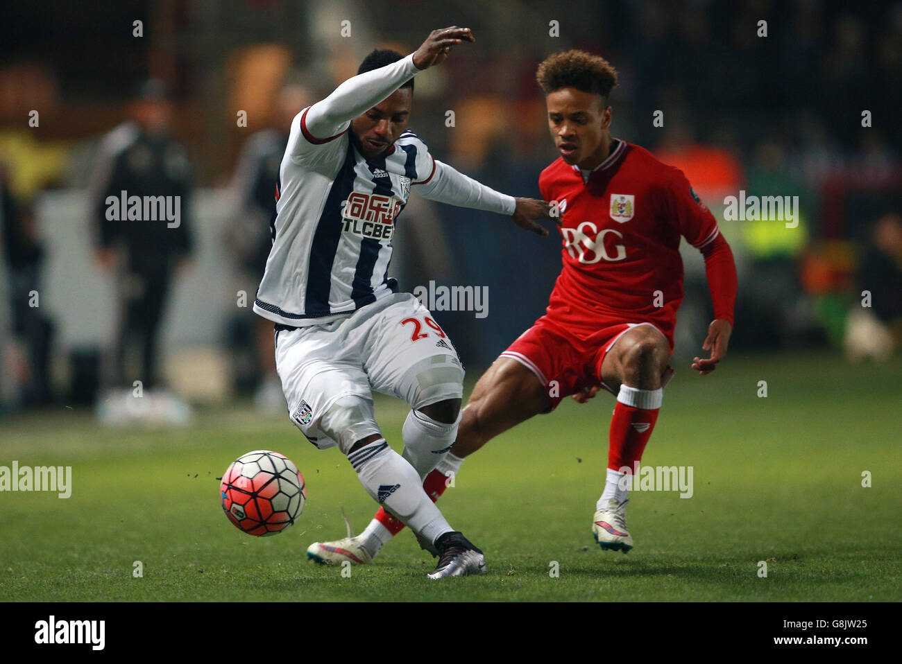 West Bromwich Albion's Stephane Sessegnon gets away from Bristol City's Bobby Reid during the Emirates FA Cup, third round replay at Ashton Gate, Bristol. Stock Photo