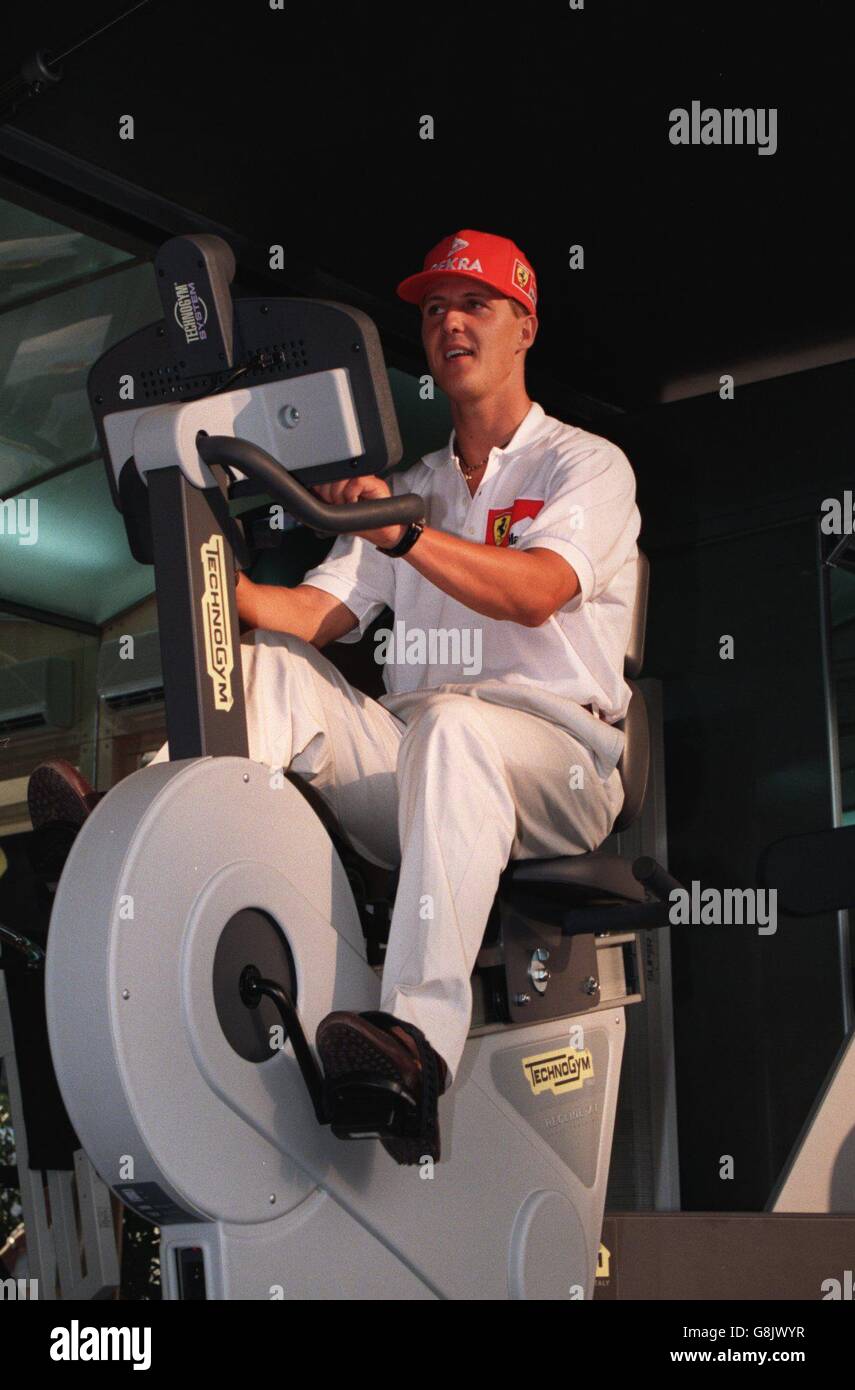 Germanys michael schumacher tries out an exercise bike hi-res stock
