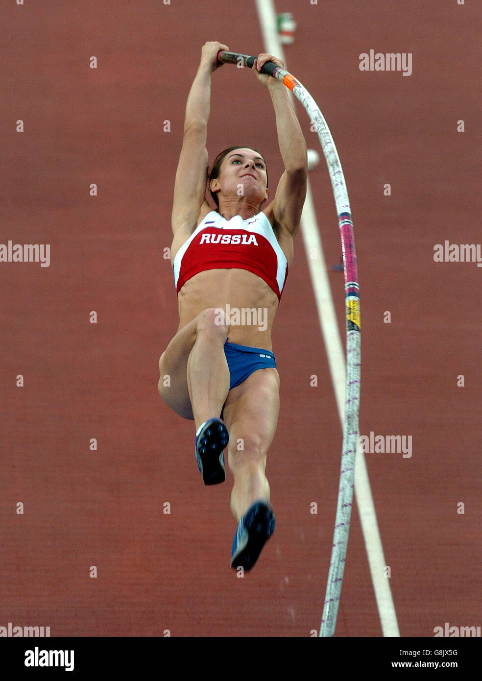 Russias yelena isinbayeva in action during the pole vault final hires stock photography and