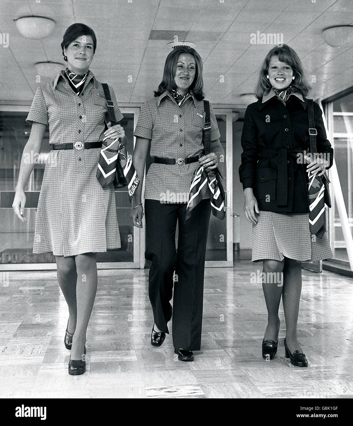 (Left to right) Marion Dodd, Sally Springford and Lee Regos, air hostesses' with Air Canada at Heathrow Airport, model new uniforms designed to enhance the airline's image. Stock Photo