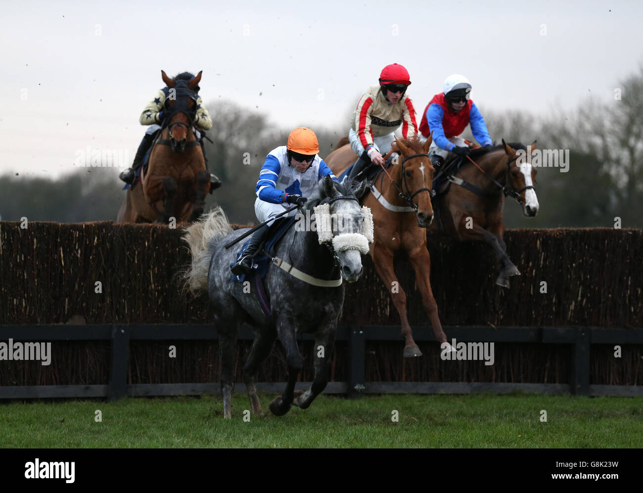 Silver Dragon ridden by Denis O'Regan (left) leads during the first circuit of the racinguk.com/anywhere Handicap Steeple Chase at Huntingdon Racecourse, Cambridgeshire. Stock Photo
