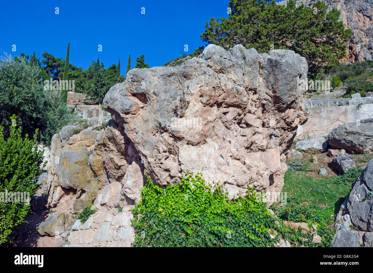 The Sibyl rock where the Delphi priestess Sibyl foretold the future at Archaeological Site of Delphi Greece. Stock Photo