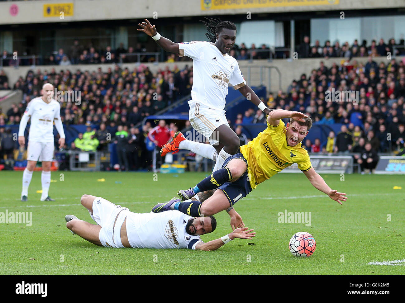 Oxford United's Alexander MacDonald is brought down and awarded a penalty during the Emirates FA Cup, third round match at the Kassam Stadium, Oxford. Stock Photo