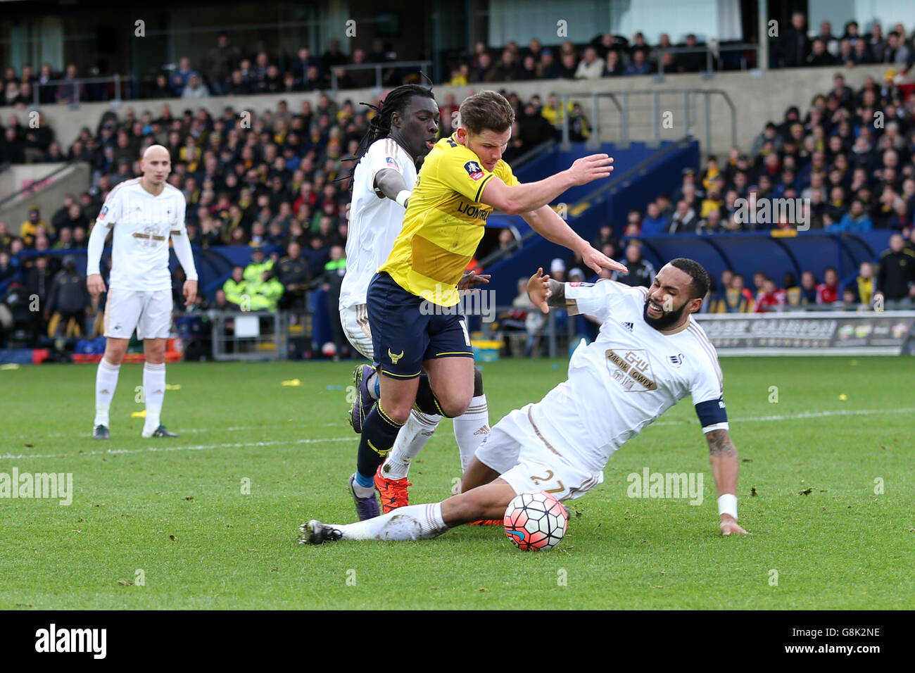 Oxford United's Alexander MacDonald is awarded a penalty after a challenge from Swansea City's Kyle Bartley during the Emirates FA Cup, third round match at the Kassam Stadium, Oxford. Stock Photo