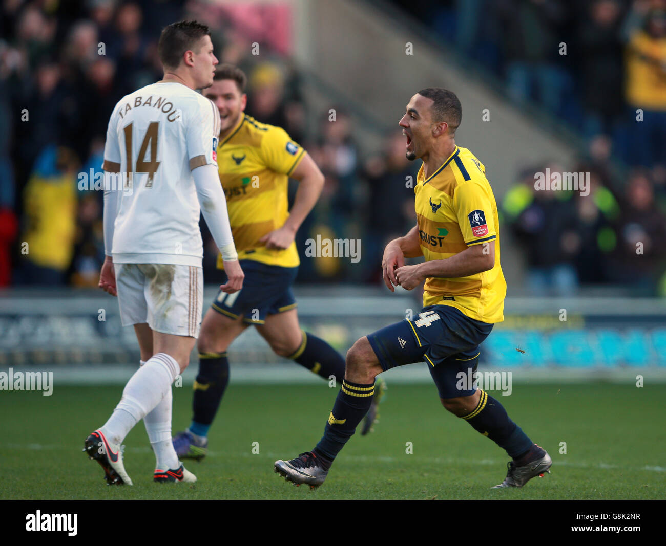 Oxford United's Kemar Roofe celebrates scoring his side's third goal during the Emirates FA Cup, third round match at the Kassam Stadium, Oxford. Stock Photo