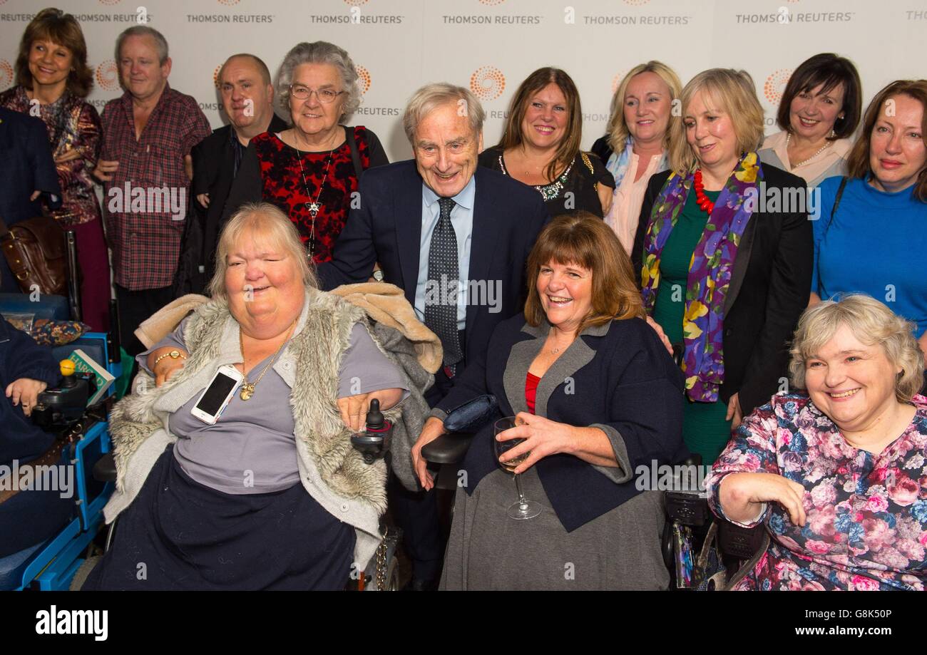 Sir Harold Evans (centre) with a group of thalidomide victims at the premiere of Attacking the Devil at the Picturehouse Central cinema in London. Stock Photo