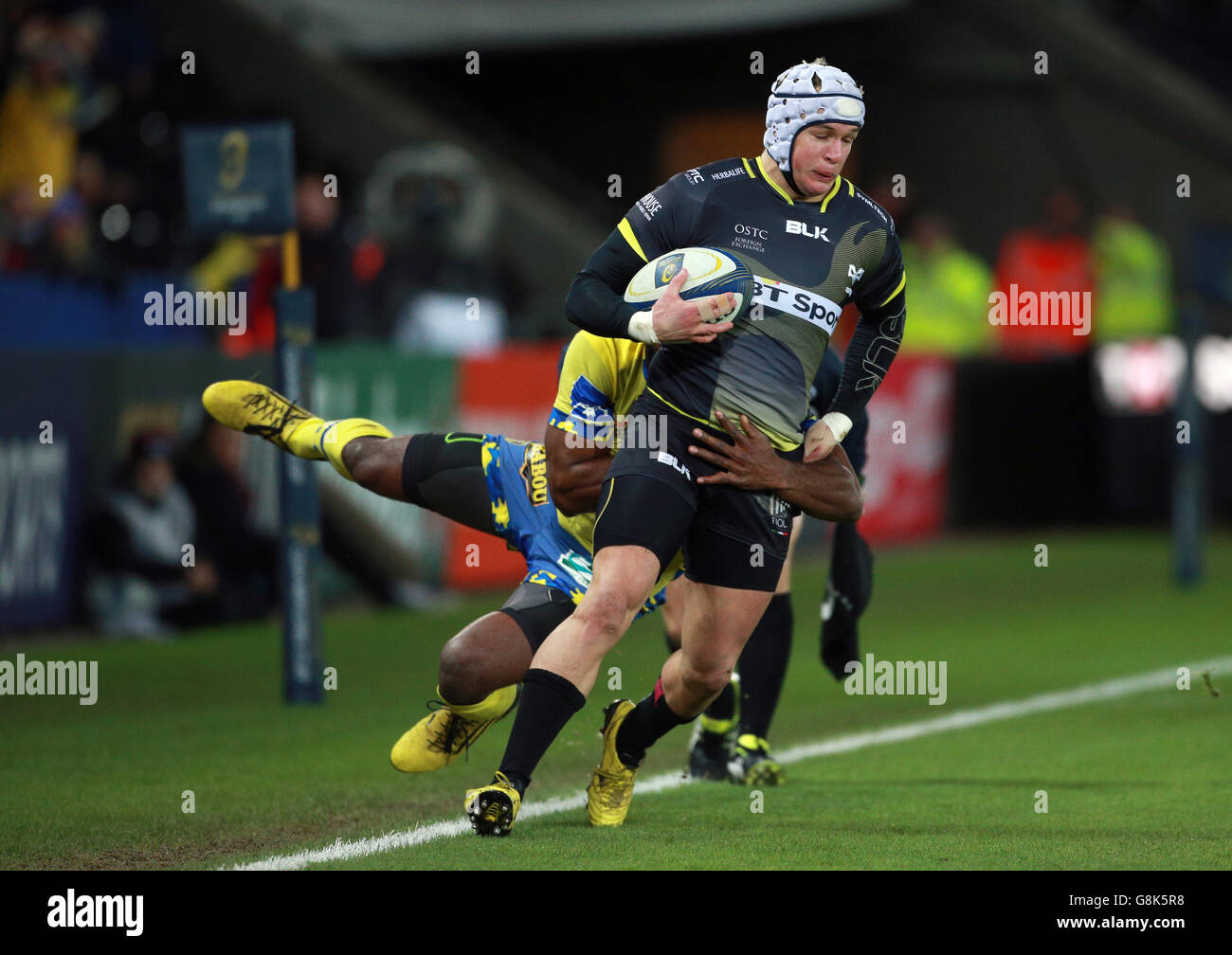 Ospreys Hanno Dirksen is tackled by Clermont's Noa Nakaitaci during the European Champions Cup, pool two match at the Liberty Stadium, Swansea. Stock Photo