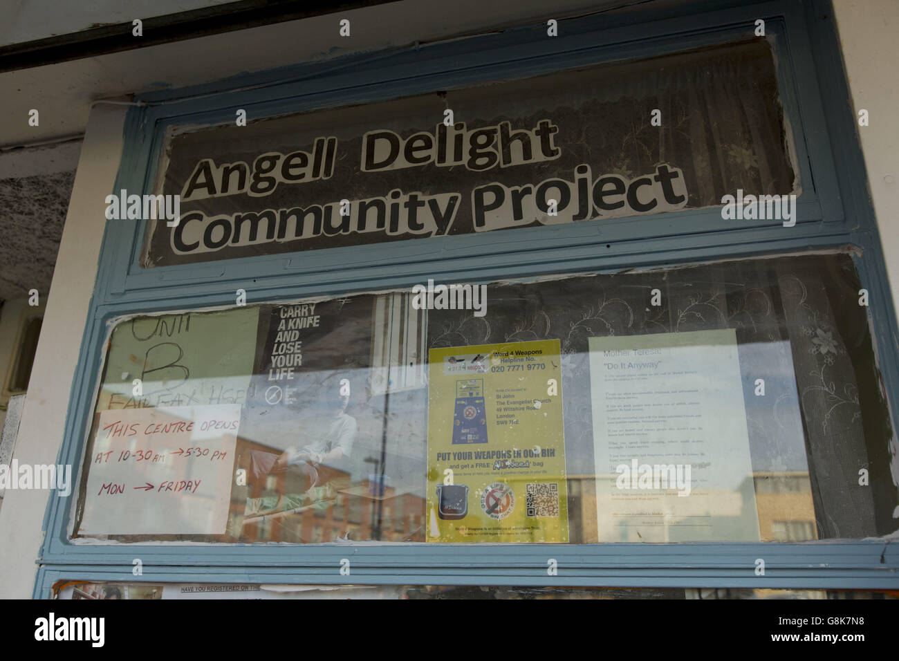 Signs and notices in the window of the Angell Delight Community Project in Angell Town estate in Brixton, south London. Stock Photo