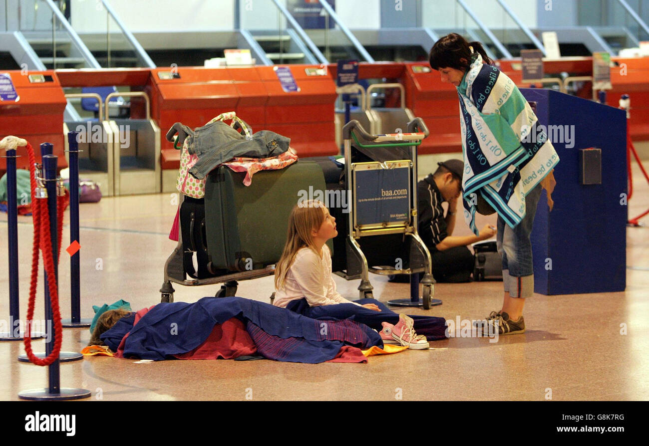 Passengers wake up in Heathrow's Terminal 4. Tens of thousands of holidaymakers and other air passengers face another day of travel chaos today after British Airways cancelled all its flights into and out of Heathrow airport because of an unofficial walkout by baggage handlers. The airline said 100 of its aircraft and 1,000 pilots and cabin crew were stranded because of the wildcat action. Stock Photo