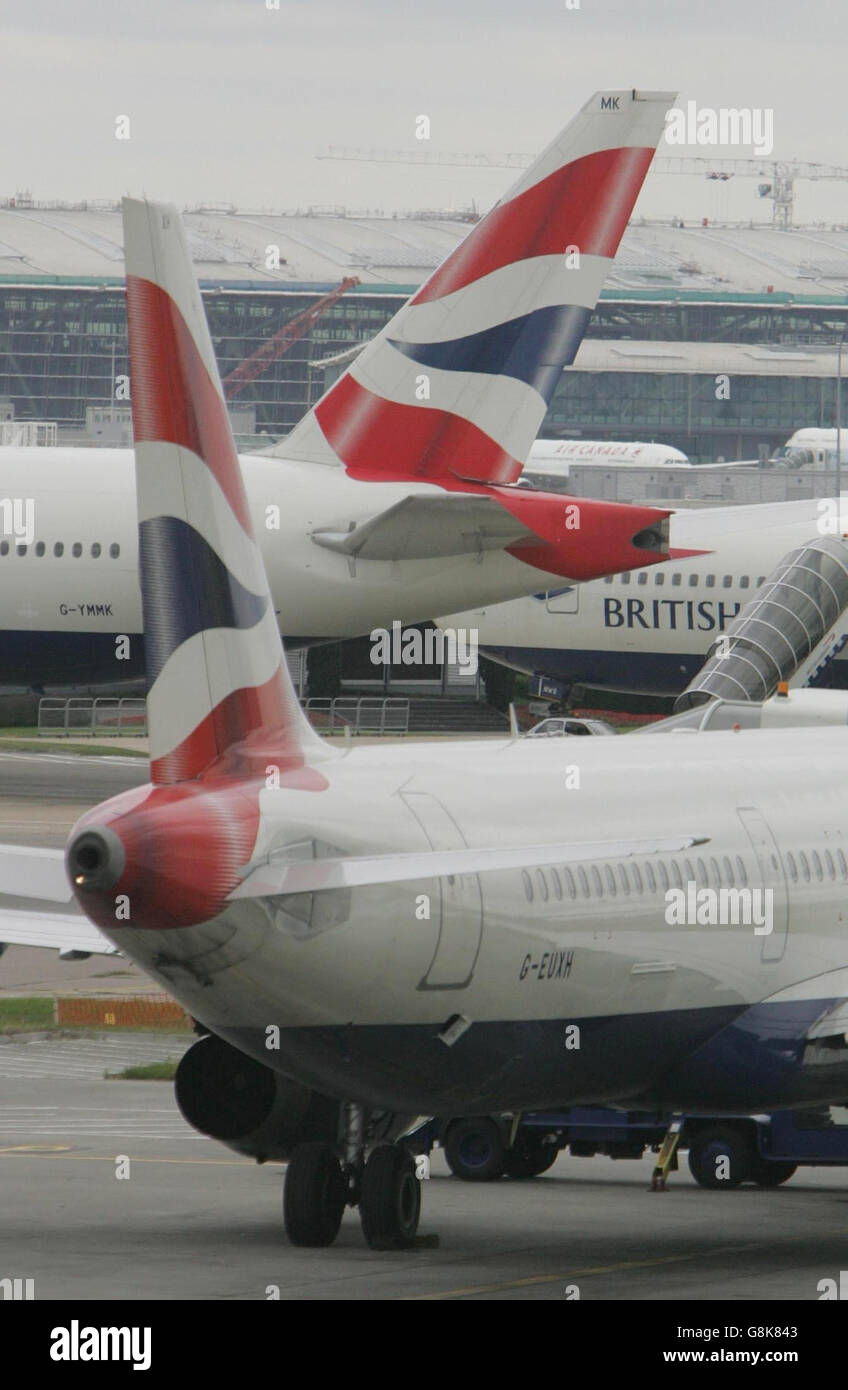 The tailfins of empty British Airways aircraft are seen from Heathrow's Terminal 4. Tens of thousands of holidaymakers and other air passengers face another day of travel chaos today after British Airways cancelled all its flights into and out of Heathrow airport because of an unofficial walkout by baggage handlers. The airline said 100 of its aircraft and 1,000 pilots and cabin crew were stranded because of the wildcat action. Stock Photo