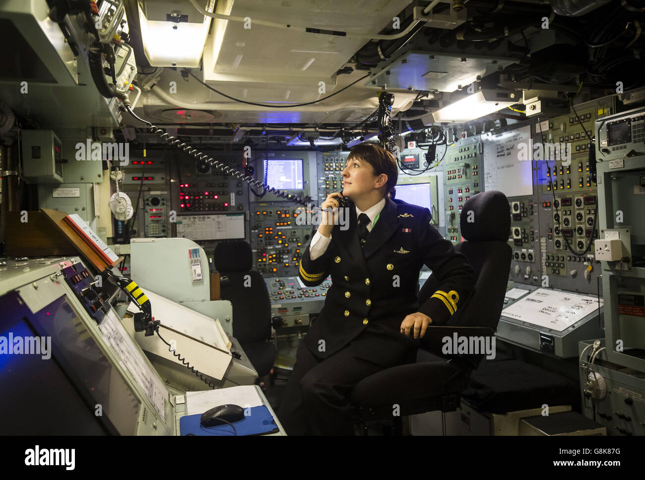 Lt Alexandra Olsson, the UK's first female submariner, in the control room on board Vanguard-class submarine HMS Vigilant, one of the UK's four nuclear warhead-carrying submarines, at HM Naval Base Clyde, also known as Faslane, ahead of a visit by Defence Secretary Michael Fallon. Stock Photo