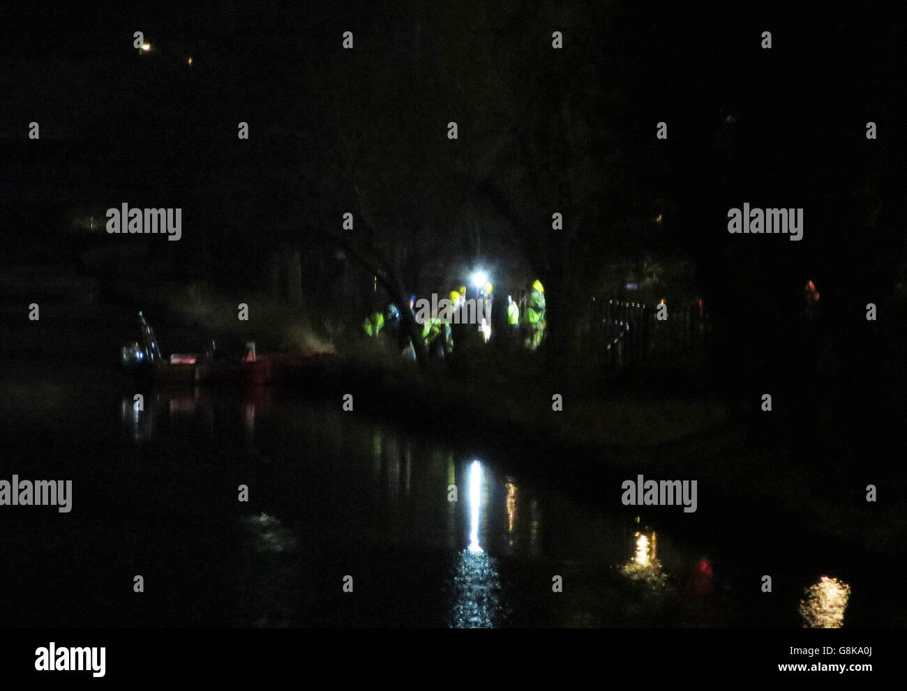Police activity near Bristol's Feeder Canal after two people died after their car plunged into the canal. Stock Photo