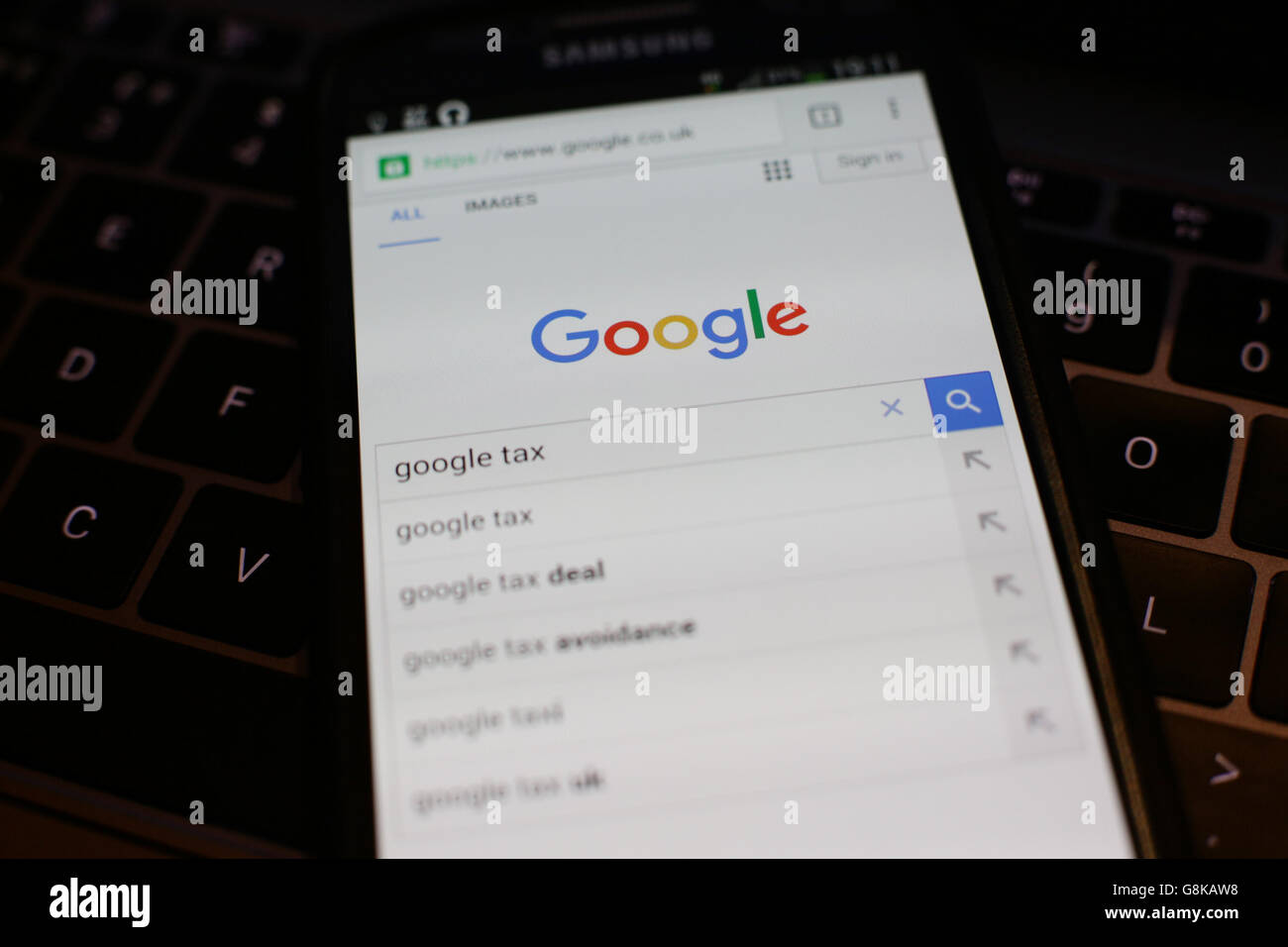 The Google search page on the screen of a mobile phone, in London ...