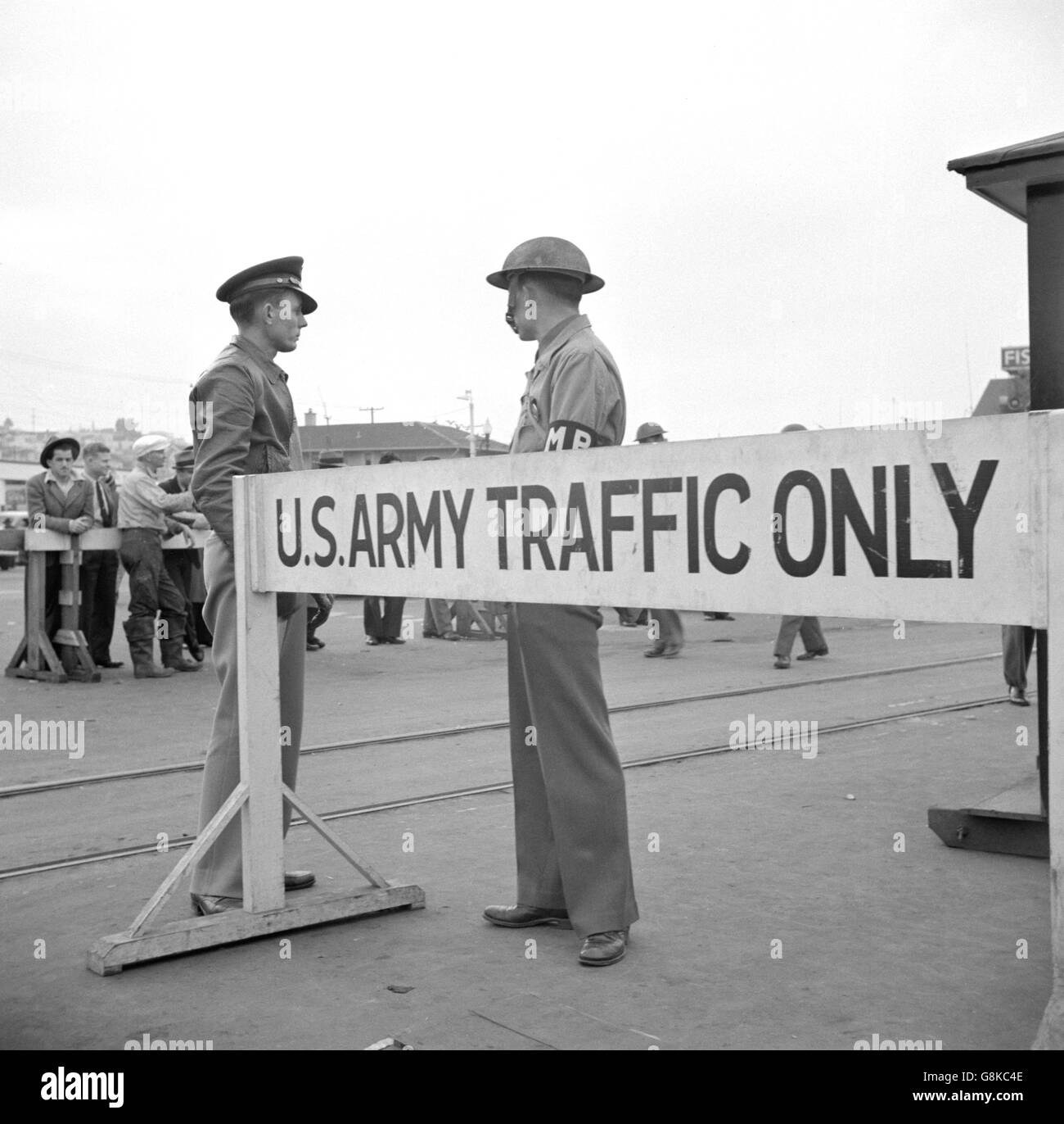 Army Sentries Standing Guard at Transport Dock one day after Japanese Attack on Pearl Harbor, San Francisco, California, USA, John Collier for Office of War Information, December 8, 1941 Stock Photo