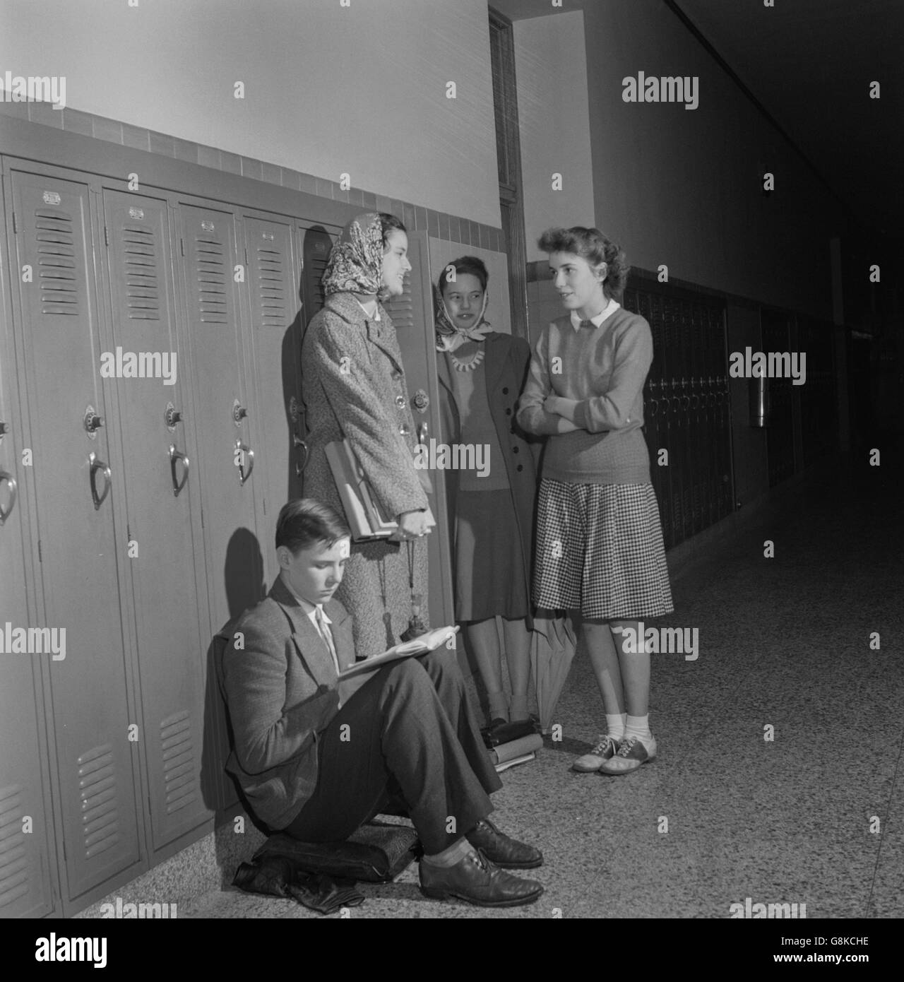 Group of High School Students Talking at Lockers, Washington DC, USA, Esther Bubley for Office of War Information, October 1943 Stock Photo