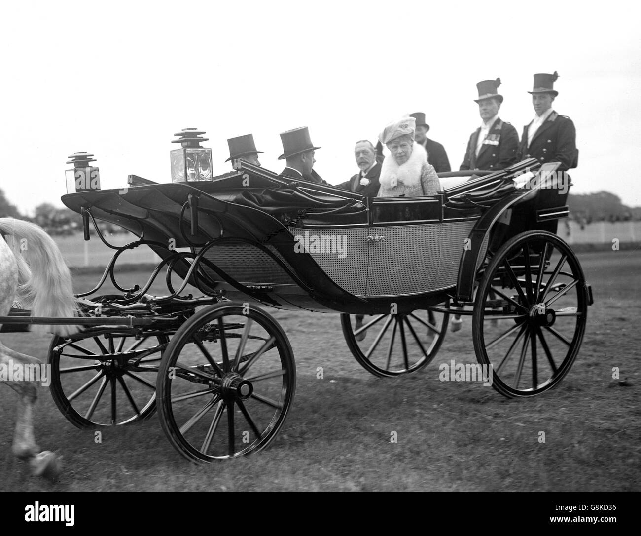 King George V and Queen Mary - Royal Ascot. King George V and Queen Mary driving along the course at Ascot. Stock Photo