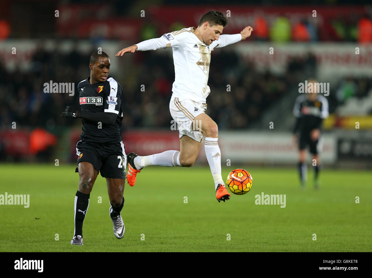 Swansea City v Watford - Barclays Premier League - Liberty Stadium. Watford's Odion Ighalo (left) and Swansea City's Federico Fernandez in action Stock Photo