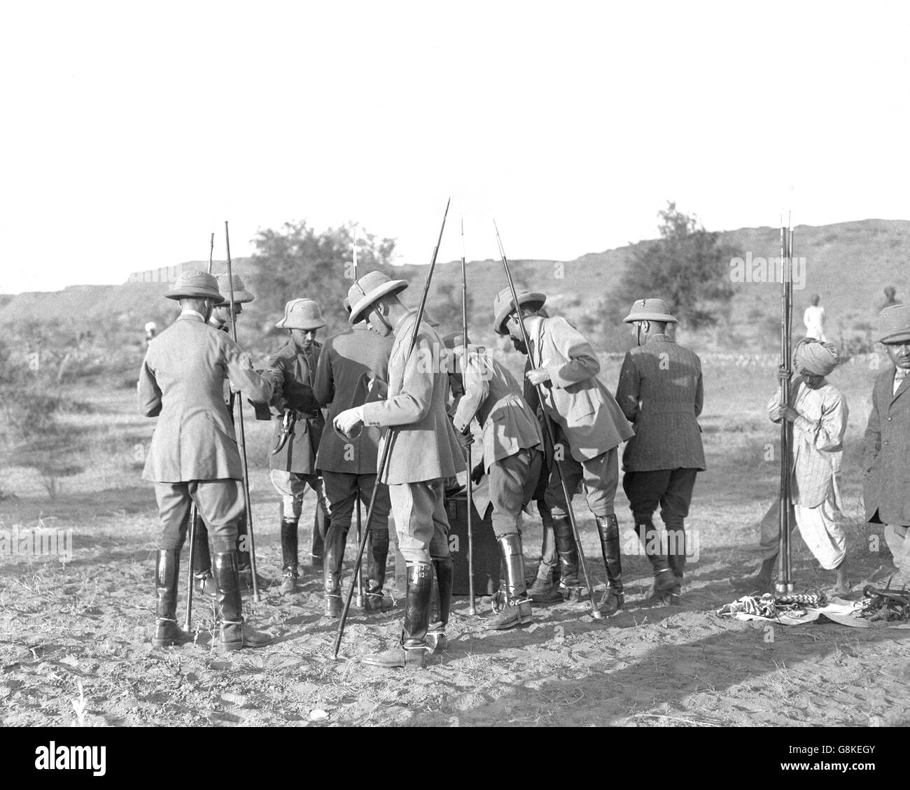 The Prince of Wales' party choose their spears during pigsticking in Jodhpur. Nearest the camera is Lord Louis Mountbatten. Stock Photo