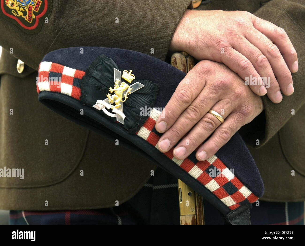 RSM Stevie Hardcastle holds his cap with a new regimental crest at the unveiling of the new Royal Regiment of Scotland crest at Edinburgh Castle. The cap badge for the new super-regiment, which features the Saltire and the Lion Rampant, incorporates the motto "Nemo Me Impune Lacessit", which means No-one Assails Me with Impunity. Stock Photo