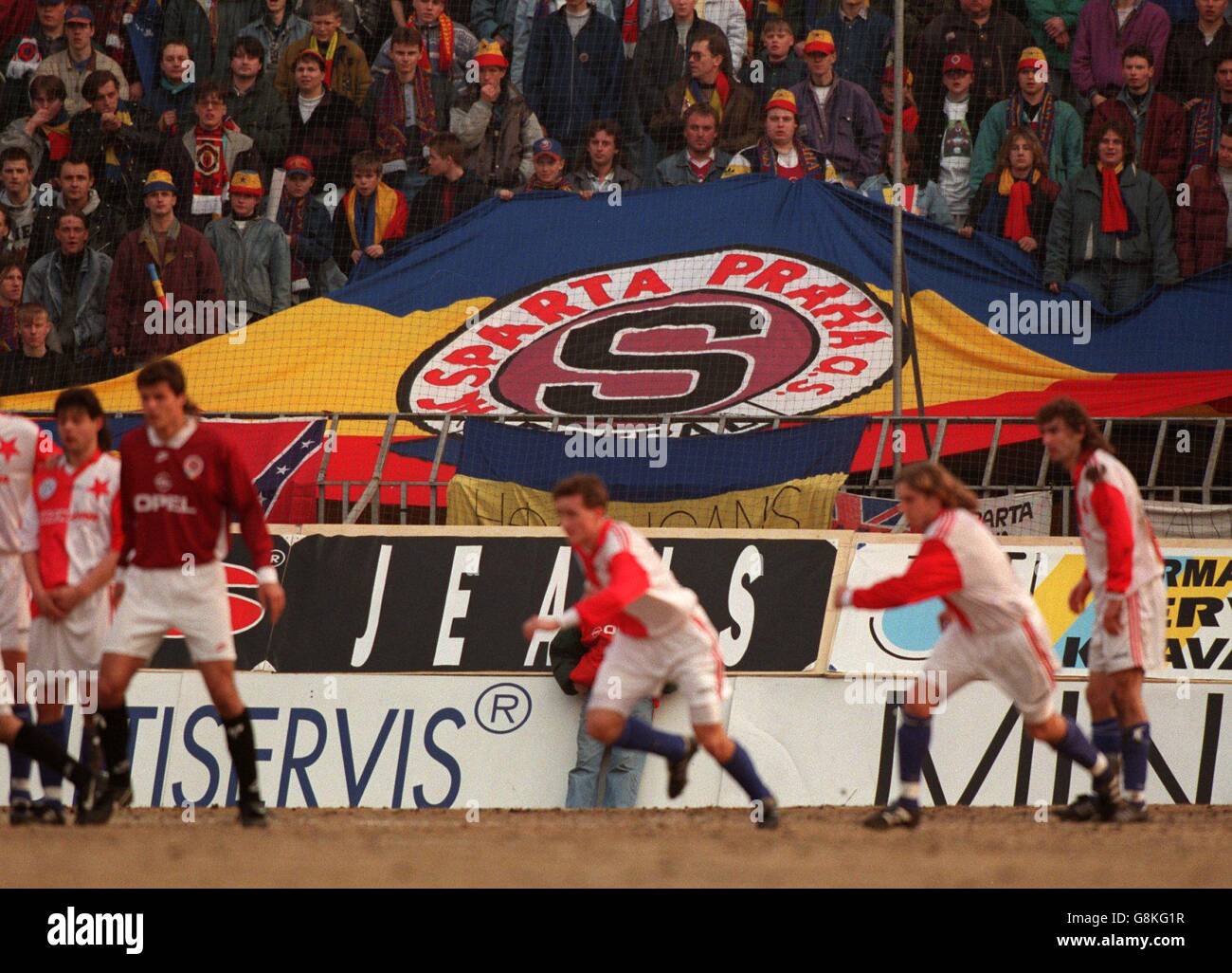 A Sparta Prague flag is held aloft in the crowd as play goes on Stock Photo
