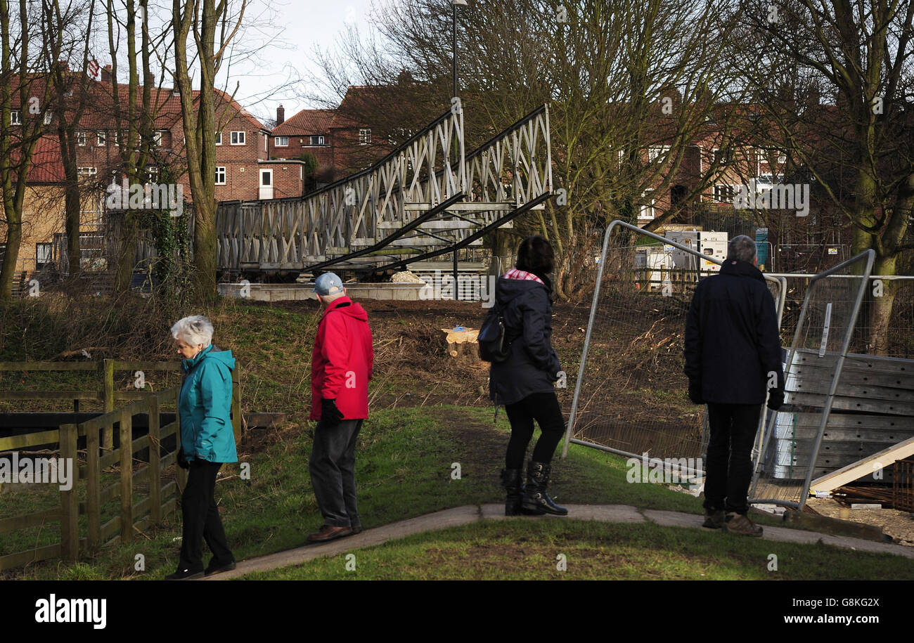 A temporary footbridge is erected to provide pedestrian access across the River Wharfe, in Tadcaster, North Yorkshire, after the historic 300-year-old road bridge collapsed on December 29 in the Christmas floods, dividing the town into two halves. Stock Photo