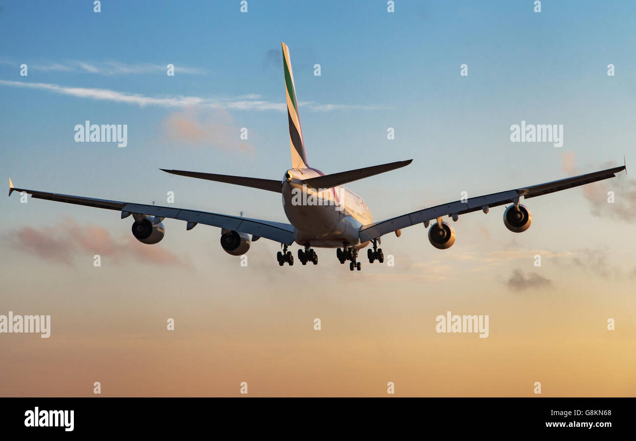 Rear view of an Emirates Airbus A380-800 landing at sunset at El Prat Airport in Barcelona, Spain. Stock Photo