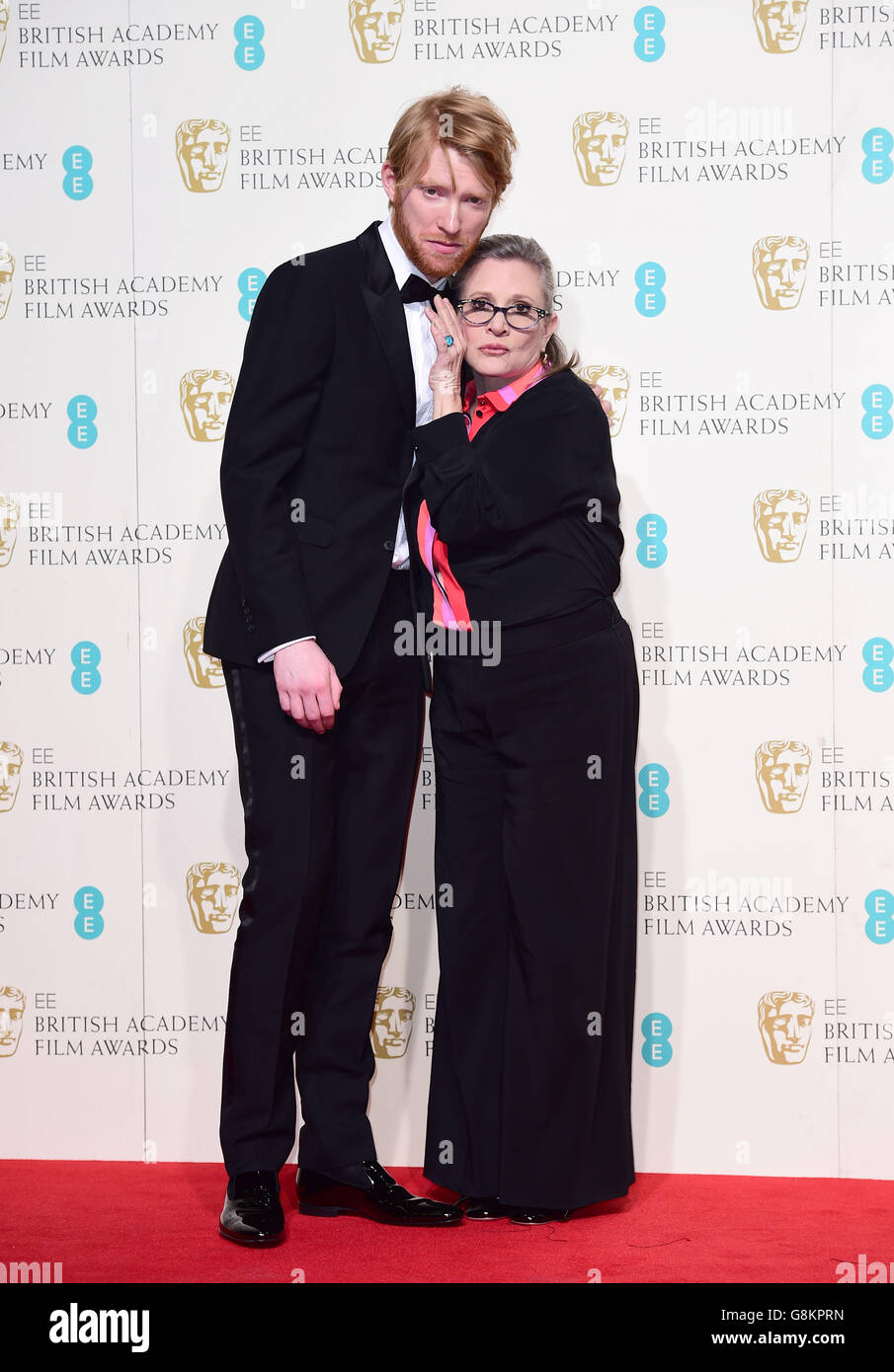 Domhnall Gleeson and Carrie Fisher in the press room at the EE British Academy Film Awards at the Royal Opera House, Bow Street, London. PRESS ASSOCIATION Photo. Picture date: Sunday February 14, 2016. See PA Story SHOWBIZ Baftas. Photo credit should read: Ian West/PA Wire Stock Photo