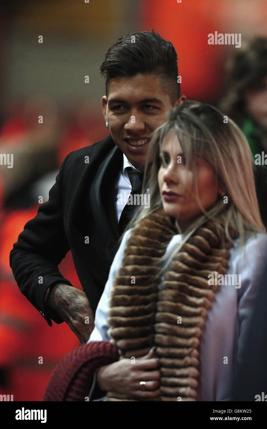 Liverpool's Roberto Firmino (left) arrives with partner ahead of the ...