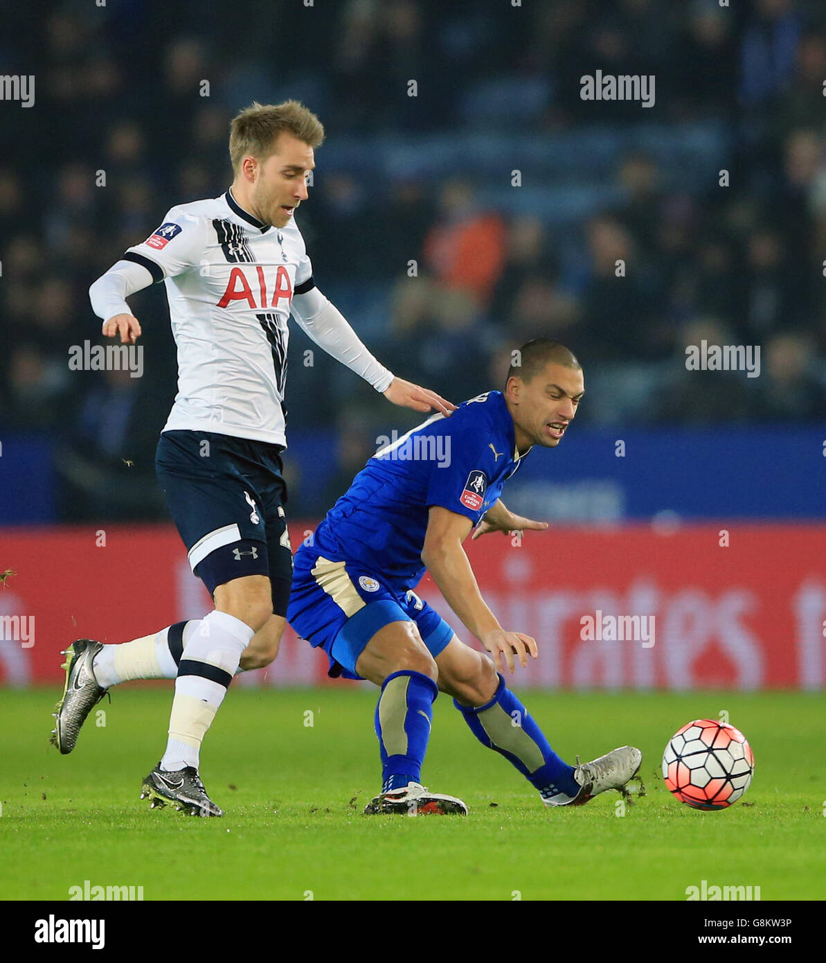 Tottenham Hotspur's Christian Eriksen (left) and Leicester City's Gokhan Inler battle for the ball during the Emirates FA Cup, third round match at the King Power Stadium, Leicester. Stock Photo