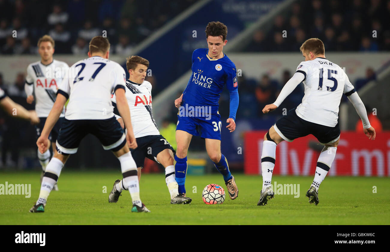 Leicester City's Ben Chilwell (centre right) battles for the ball with Tottenham Hotspur's Tom Carroll (centre left) and Eric Dier (right) during the Emirates FA Cup, third round match at the King Power Stadium, Leicester. Stock Photo