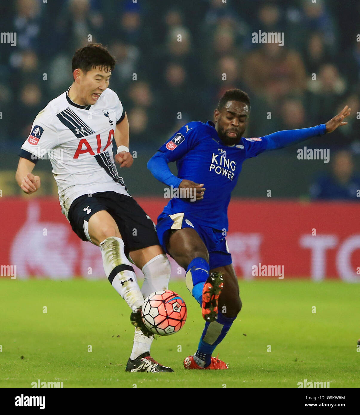 Tottenham Hotspur's Son Heung-Min (left) and Leicester City's Nathan Dyer battle for the ball during the Emirates FA Cup, third round match at the King Power Stadium, Leicester. Stock Photo