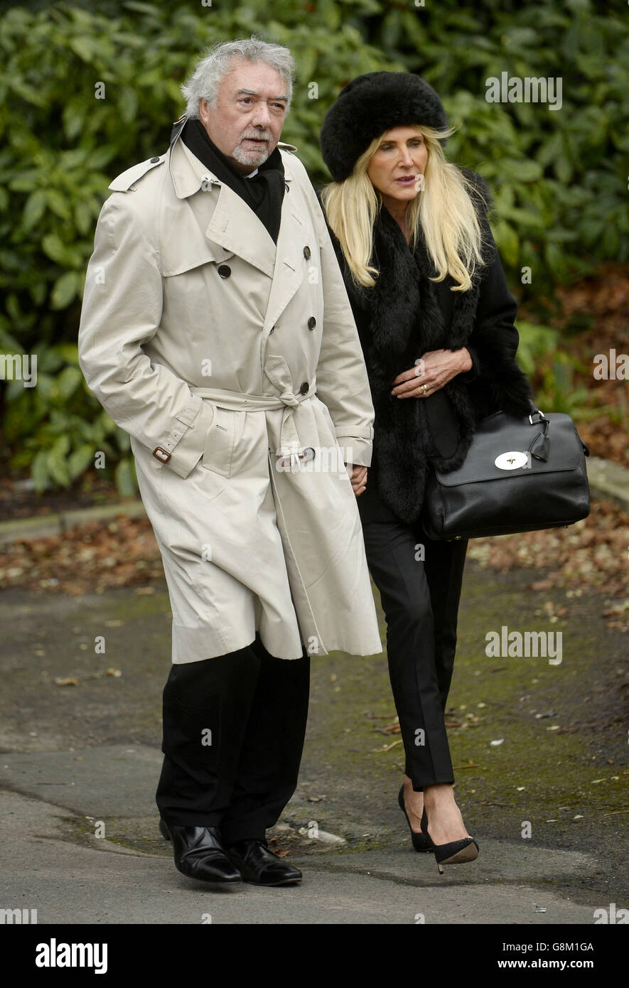 John Virgo and his wife Rosie attend the funeral of the former disc jockey and TV presenter DJ Ed 'Stewpot' Stewart, taking place at St Peter's Church in Bournemouth. Stock Photo