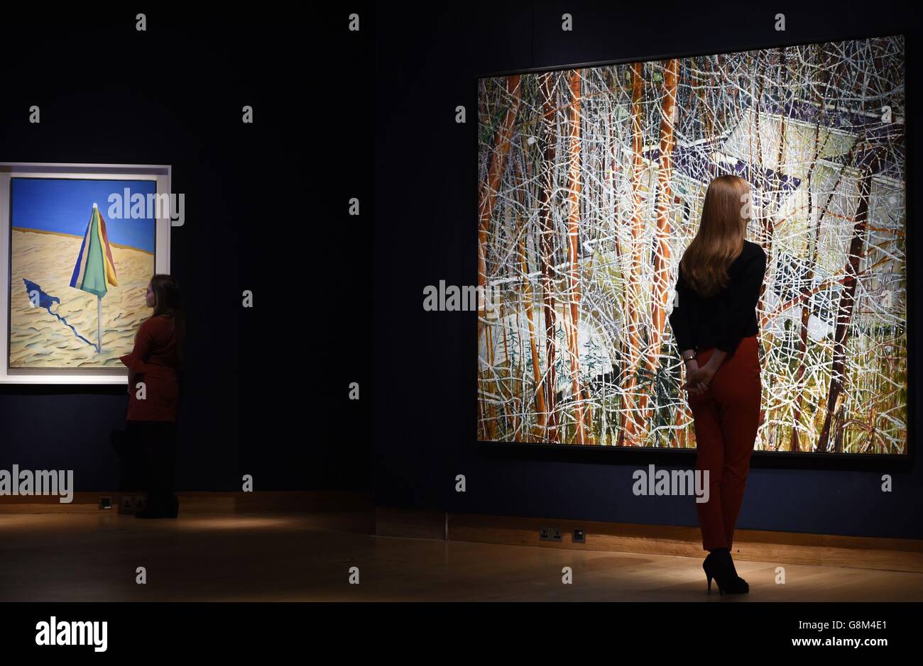 Christie's gallery assistants look at Beach Umbrella by David Hockney ...