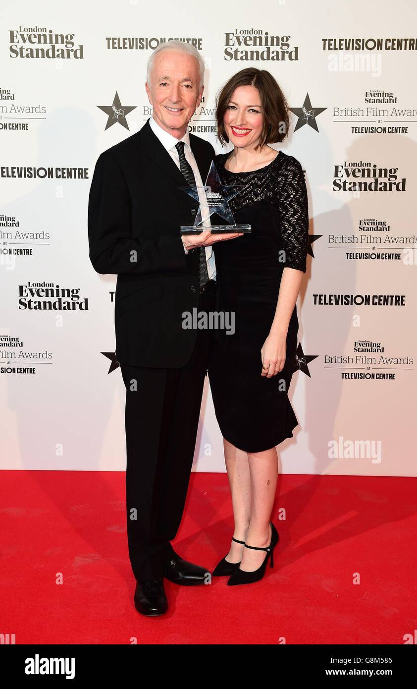 Anthony Daniels accepts the Blockbuster of the Year award for Star Wars: The Force Awakens, presented by Kelly Macdonald (right) at the London Evening Standard British Film Awards at the Television Centre, White City, London. Stock Photo