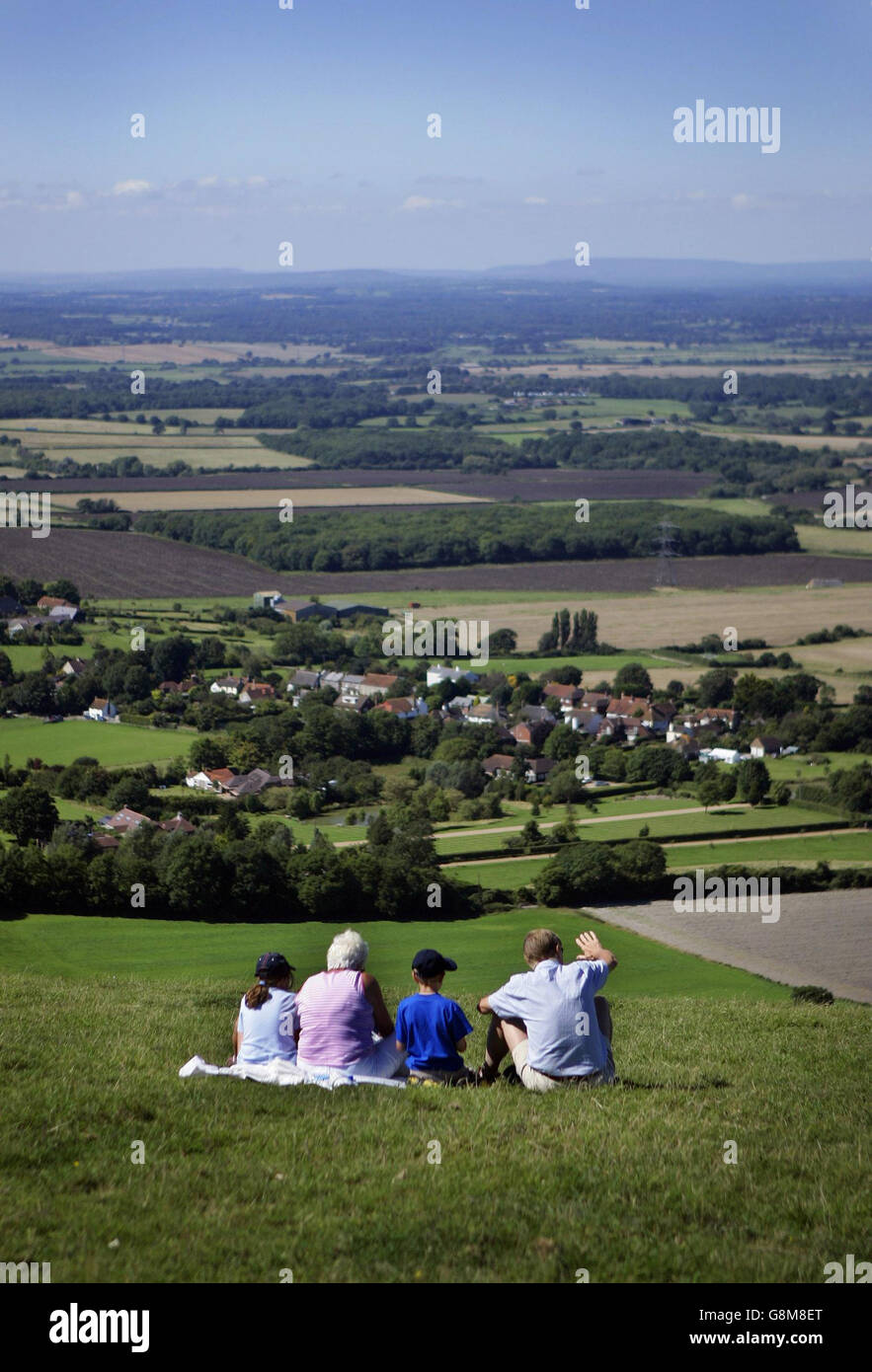 Day trippers enjoy a sunlit view over the Weald to the North Downs in West Sussex Sunday August 28th 2005, on the Bank Holuiday weekend. PRESS ASSOCIATION Photo: Fiona Hanson/PA Stock Photo