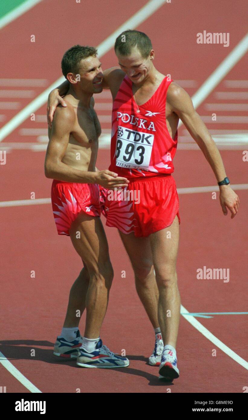 Tomasz Lipiec of Poland (right) congratulates gold medallist Robert Korzeniowski of Poland (left) Stock Photo