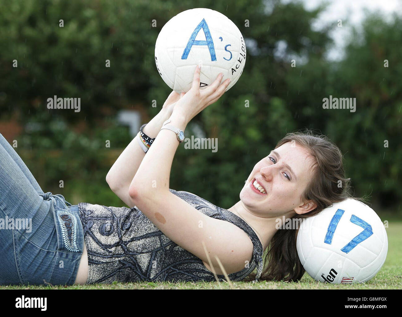 Keen footballer Rachael Grandey, 16 celebrates after notching up 15 A*s and 2 A grades in her GCSE results at Acklam Grange School, Teeside. The 16-year-old managed A*s in English language, media studies, maths, statistics, biology, chemistry, physics, French, German, physical education, religious studies, history, music and art (two A*s with one for a vocational course). Apart from studying, Rachel, the school's head girl, is involved in a variety of activities from the school's football team to playing the violin and rock guitar, peer mentoring groups, rock climbing and canoeing. She is Stock Photo