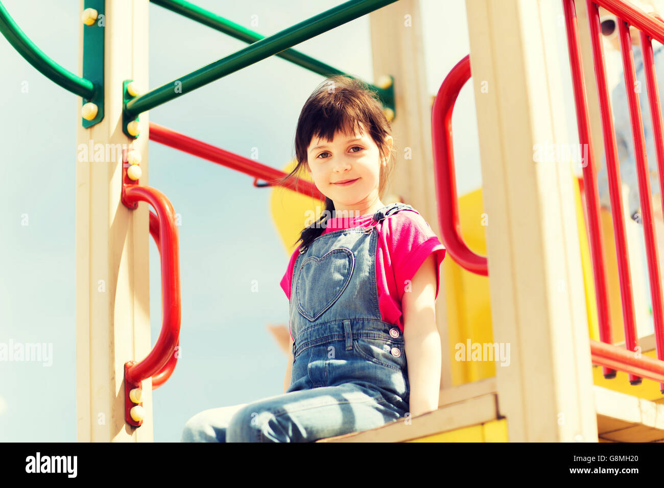 happy little girl on children playground Stock Photo - Alamy
