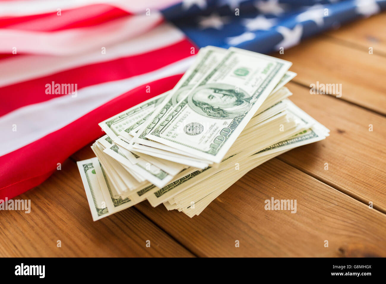 close up of american flag and dollar cash money Stock Photo