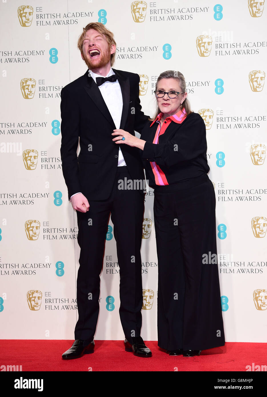 Domhnall Gleeson and Carrie Fisher in the press room at the EE British Academy Film Awards at the Royal Opera House, Bow Street, London. PRESS ASSOCIATION Photo. Picture date: Sunday February 14, 2016. See PA Story SHOWBIZ Baftas. Photo credit should read: Ian West/PA Wire Stock Photo