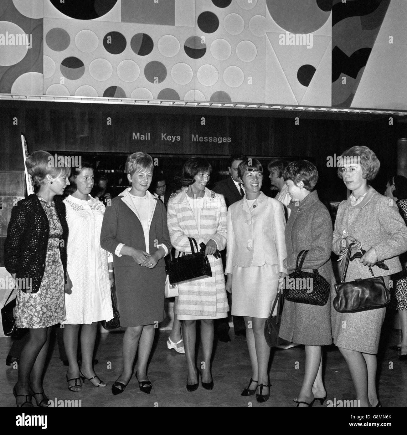 Wives and girlfriends of the England players gather at the Royal Garden Hotel, Kensington, before going to see The Black and White Minstrel Show, on the eve of the World Cup Final: (l-r) Leslie Newton (Alan Ball's fiancee), Judith Hurst (Geoff's wife), Kay Stiles (Nobby's wife), Norma Charlton (Bobby's wife), Mrs Wilson (Ray's wife), Carol Paine (Terry's wife) and Ursula Banks (Gordon's wife). Stock Photo