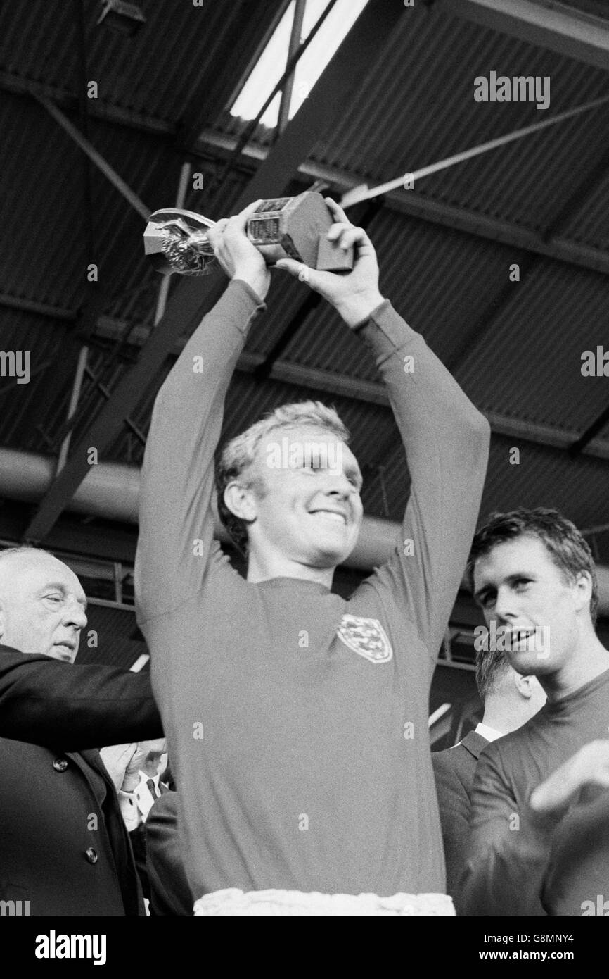 England v West Germany - 1966 World Cup Final - Wembley Stadium. England captain Bobby Moore lifts the Jules Rimet trophy after his team's 4-2 win in the final Stock Photo